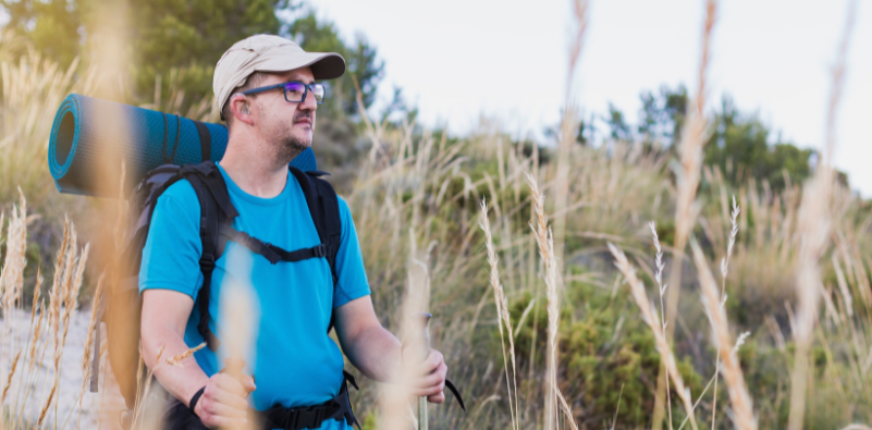 A man carrying a backpack on a hike