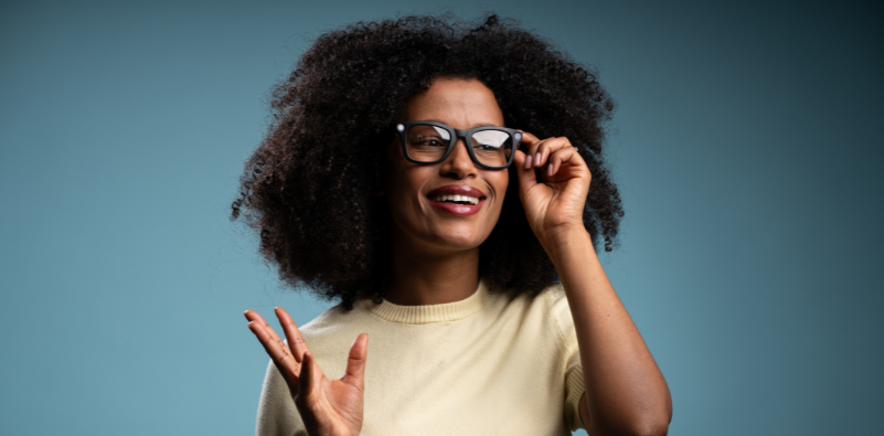 A woman posing wearing smart glasses